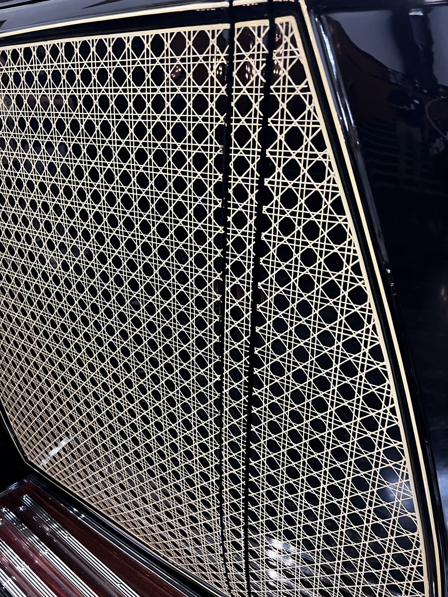 Woven caning detail on a coachbuilt Rolls-Royce photographed first-hand by Omar Mukhtar.