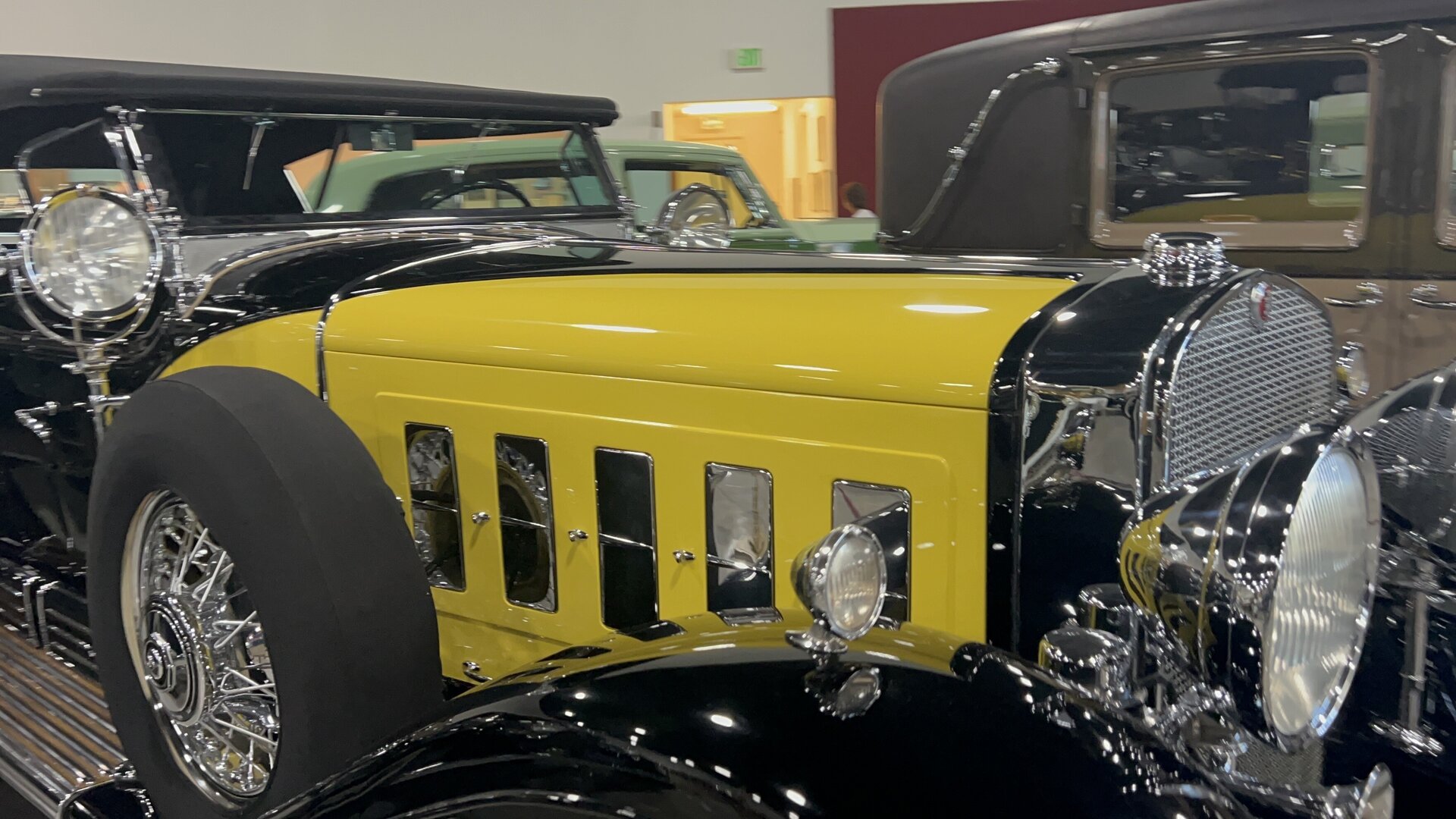 Early Cadillac in yellow photographed first-hand by Omar Mukhtar at the Nethercutt Collection.