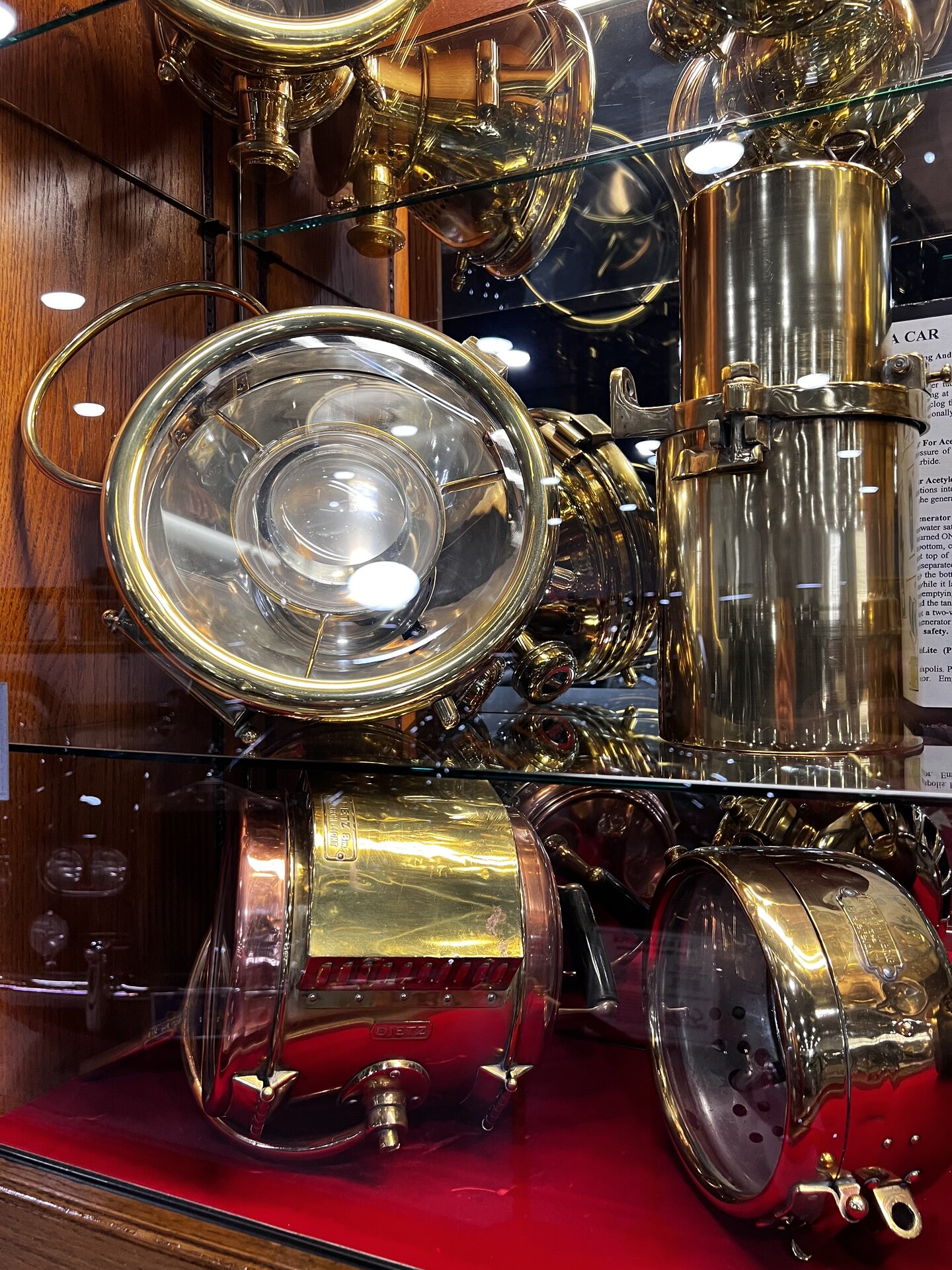 Vintage car headlamp photographed first-hand by Omar Mukhtar at the Nethercutt Collection.